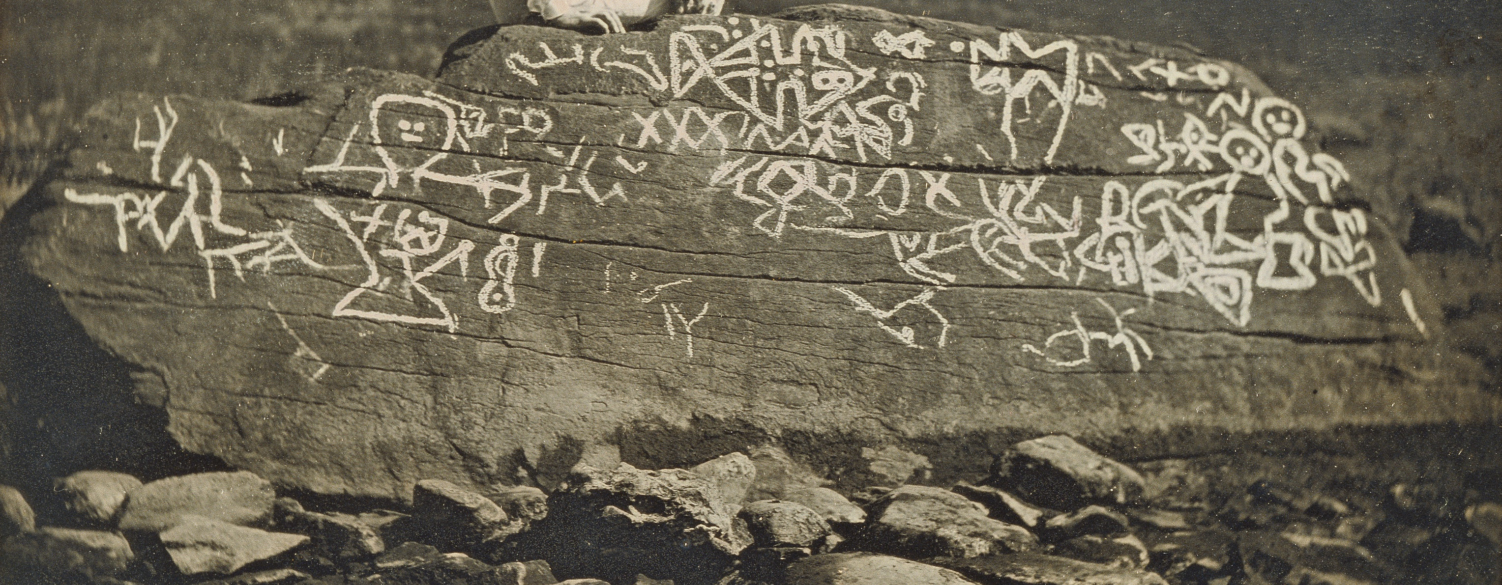 Crop from Seth Eastman at Dighton Rock by Horatio B. King, 1853.  Petroglyphs are traced with chalk.